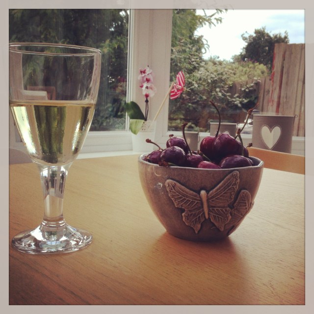 Celebrating the arrival of the weekend with a glass of wine and a bowl of black cherries last night